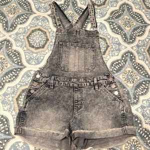 Stretchy denim style short overalls.